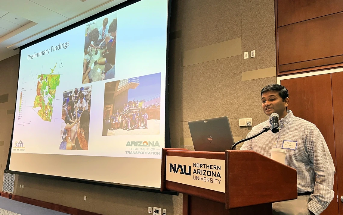 At the 2025 Arizona Transportation Institute Summit, U of A assistant professor Tejo Bheemasetti shows data associated with the number of battery-laden EVs on the road.