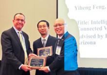 Yiheng Feng, center, with his best dissertation award from the Chinese Overseas Transportation Organization with UA professor Larry Head, left, and COTA president Yafeng Yin.