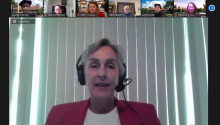 Screencap of a Zoom meeting with Ann Wilkey at the center and a row of other people on top.