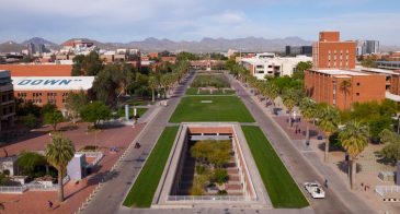 A bird's eye view of the University of Arizona mall with mountains in the distance