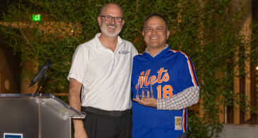 Ricardo Valerdi, right, accepts the #MadeItHappen award from Doug Hockstad. Photo: Tech Launch Arizona